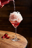 Strawberry cocktail with candy floss