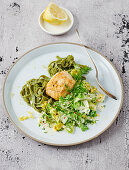 Monkfish fillets with Chinese cabbage in pepper cream and green ribbon noodles