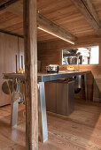 Stainless steel kitchen counter in a wooden hut