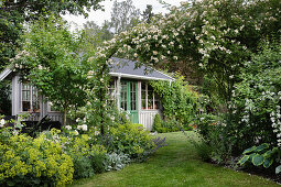 View over rose arch to orangery