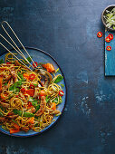 Asian egg noodle salad with chicken and vegetables