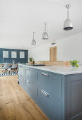 Center kitchen island with drawers in an open kitchen