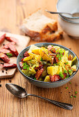 Savoy cabbage stew with chimney sausage