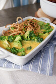 Broccoli cheddar sauce with fried onions