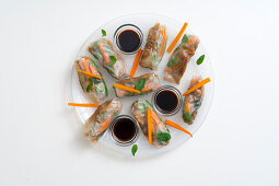 Rice paper rolls with caramelized chicken meat and sauce