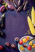 Auberginen, corn and plums