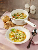Noodle stew with vegetables and cheese dumplings