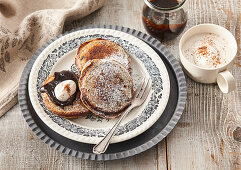 Poppy seed pancakes with plum butter and cinnamon whipped cream