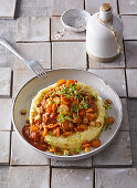 Pork and beef stew with root vegetables and mashed potatoes