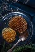 Honeycombs with spoon on a plate