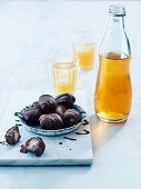 Chocolate peanut butter balls (raw) served with kombucha