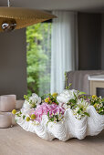 Flowers in a shell-shaped bowl