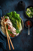 Chicken broth with noodles and vegetables