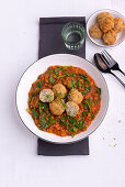 Red lentil dal with spinach and fried rice balls