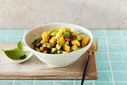 Vegan mango and avocado salad with kidney beans and basil