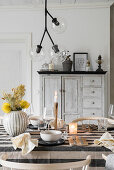 Set dining table, with pendant light with glass globes above table