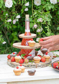 Self-made etagere for a bulbous bottle made of suitably cut wooden discs