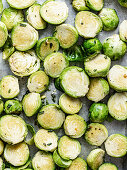 Halved Brussels sprouts on an oven tray (unbaked)