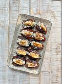 Stuffed dates with parsley cream cheese and walnuts