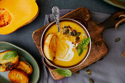 Pumpkin soup with crostini and pumpkin seeds