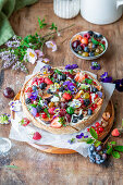 Vanilla berry tart with flowers