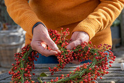 Heart of rose hips on a bent wire wreath blank