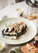 Fig and goatscheese open sandwich on charcoal soardough bread