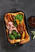 Giant Yorkshire pudding with roastbeef, roasted potato, broccoli and young carrots