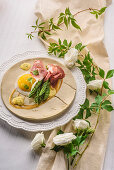 Asparagus with duck egg, San Daniele ham, and cheese sauce