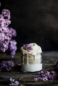 Banana dessert with yogurt amaranth and lilac blossoms