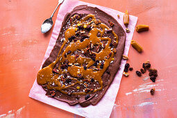 Chocolate bark with caramel, dried fruit, pecans and sea salt