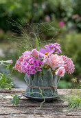 Pink arrangement of roses, phlox, hydrangeas and ornamental baskets