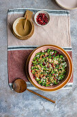 Jewelled broccoli salad with feta, pomegranate seeds and tahini dressing