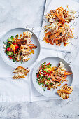 Chilli and herb seafood skewers with romesco salad