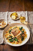 Hake with brown butter, chard, hazelnuts, and orzo