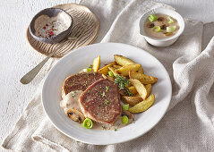 Fillet of beef with yogurt sauce and baked potato wedges