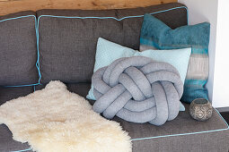 DIY knot cushion on grey sofa