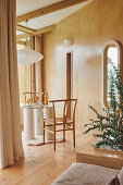 View into corner of room with small round table and two chairs