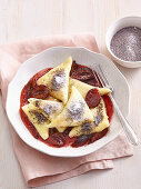 Potato ravioli with plum jam filling and plum sauce