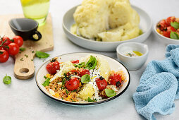 Cauliflower with herb yogurt and tomato curry couscous