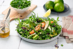 Baked Salmon on avocado arugula salad