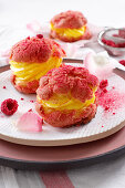 Choux Craquelin with cream filling and raspberry crumble