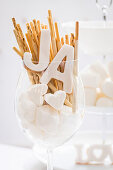 Marshmallow hearts, salted sticks and 'YES' letters in a jar