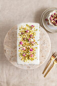 Gluten-free loaf cake with pistachios, lemon and rose petals