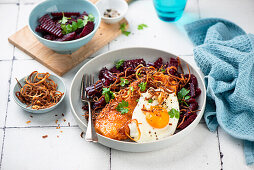 Schnitzel with fried egg and beetroot salad