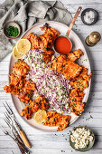 Grilled chicken with spicy sauce and coleslaw