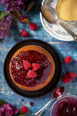 Steamed sponge pudding with raspberry jam and fresh raspberries (Great Britain)