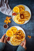 Almond milk pancakes with orange slices, figs and chocolate chips