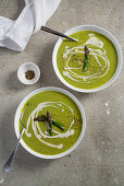 Vegan cream of asparagus soup with green asparagus and white beans