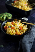 Baked pumpkin ricotta pasta from the oven with sage and olive oil